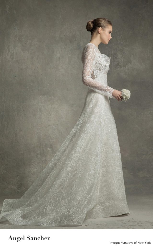 Traditional long sleeve gown with sheer back conveys ellegance.